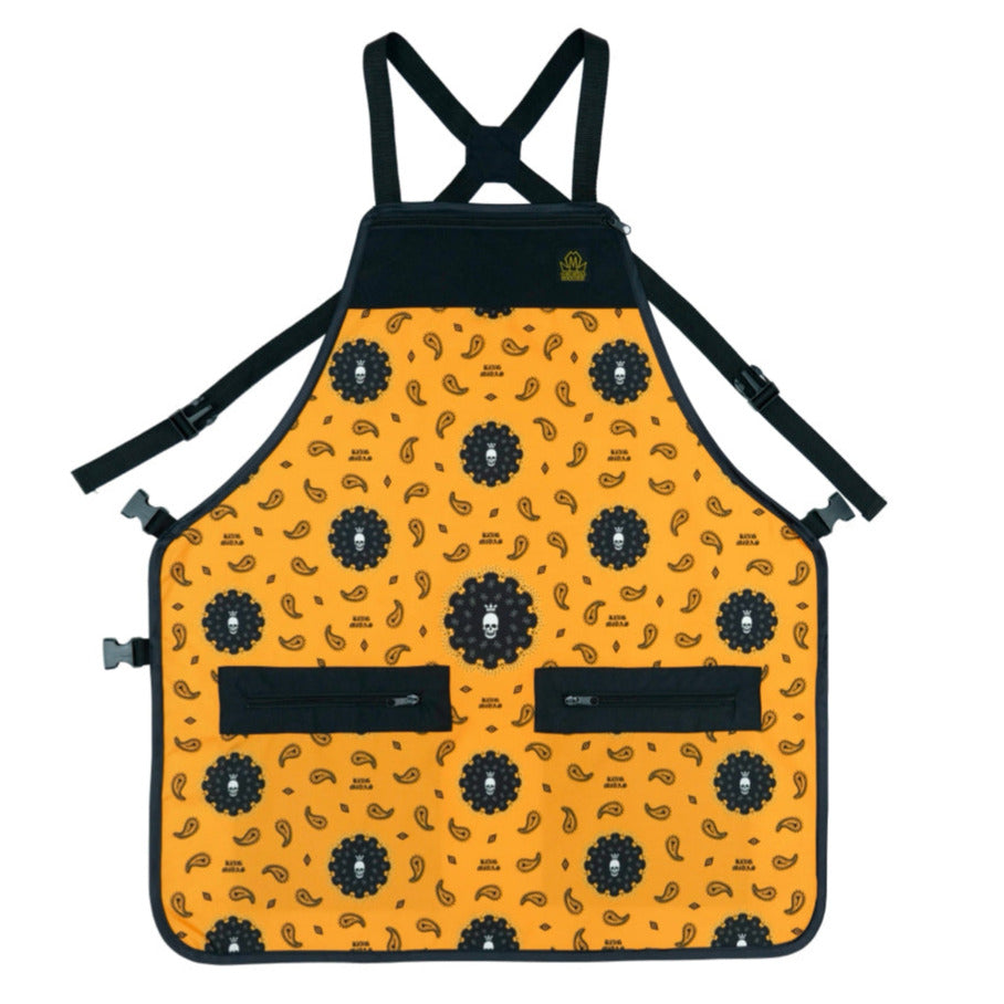 Orange bandana hair stylist apron with bandana patterns and straps on a white background