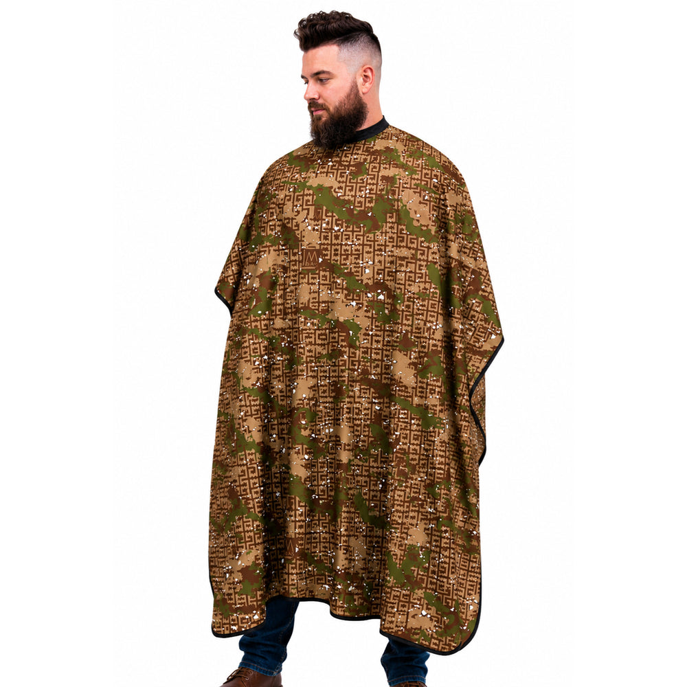 A man wearing a brown camouflage-patterned barber cape  against a plain white background.