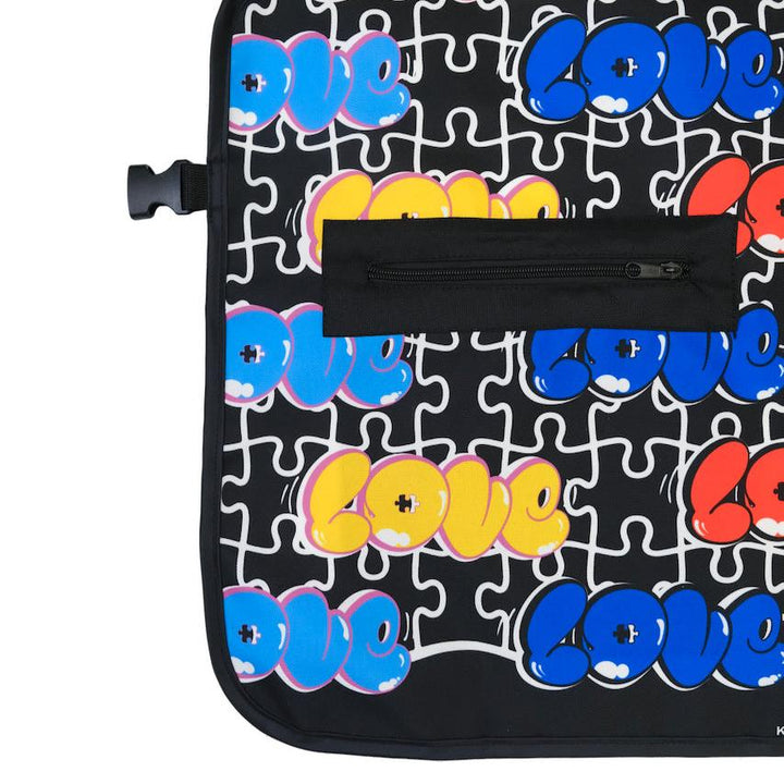 Barber apron with 'LOVE' text in colorful letters on a black background