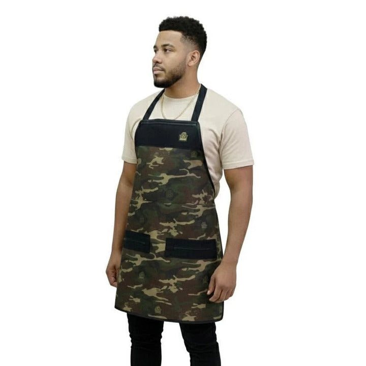 Man wearing a camouflage barber apron on a white background