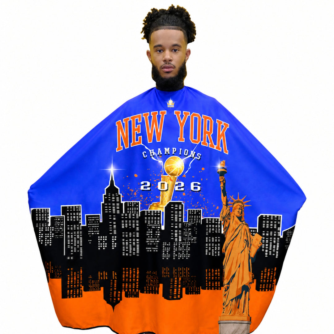 Man wearing a blue and orange Knicks barber cape with New York Champions 2026 design.