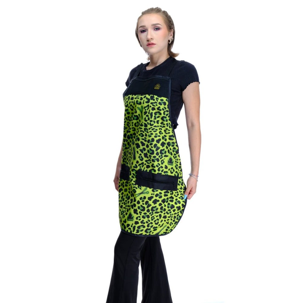 Person wearing a green leopard print salon apron. Apron for hair stylists.