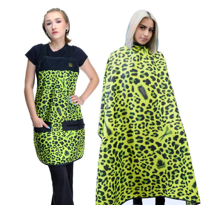 Two people wearing matching green leopard print salon aprons and salon capes on a white background