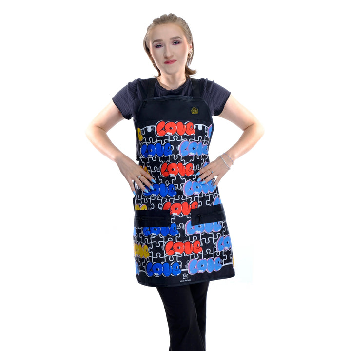 Person wearing a love a barber apron- hair. stylist apron- barber apron for men- denim barber apron - jeans barber apron-barber apron for sale - mens barber apron-apron for barbers -barber aprons -