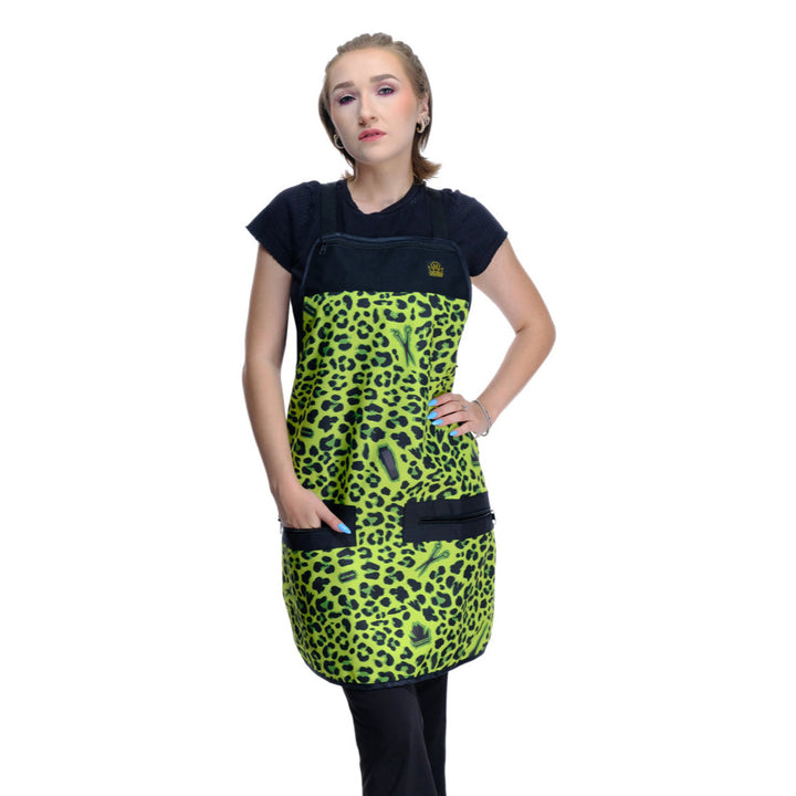 Person wearing a black and green leopard print hair stylist apron barber apron on a white background