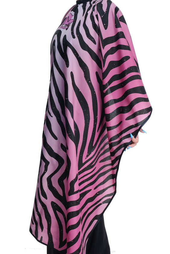 Person wearing a pink salon cape- pink styling cape - pink hair stylist cape - pink hair dresser cape