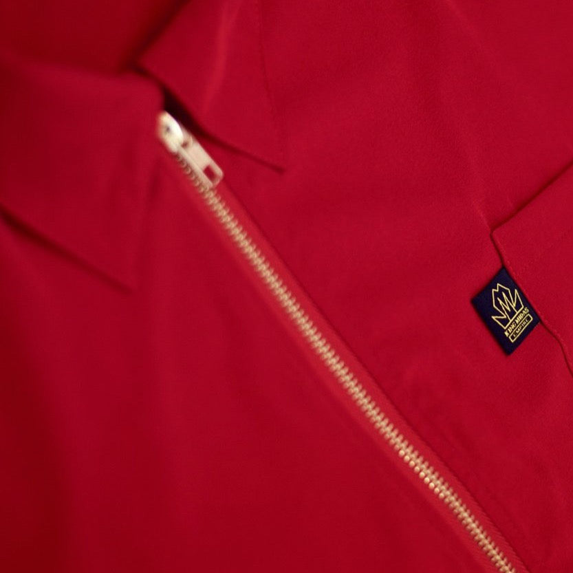 Red King Midas barber jacket and hair-resistant barber smock.