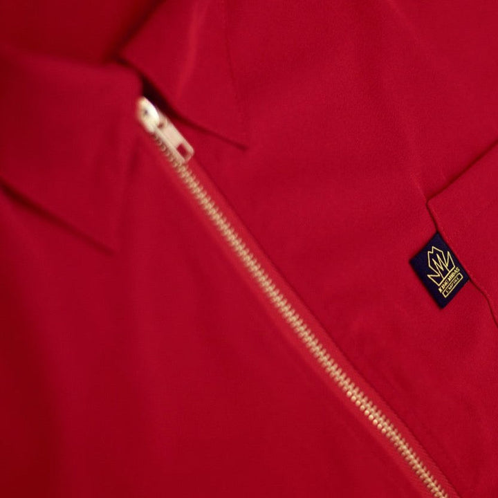 Red King Midas barber jacket and hair-resistant barber smock.
