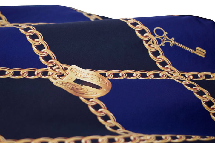 Gold chain design on a blue cape